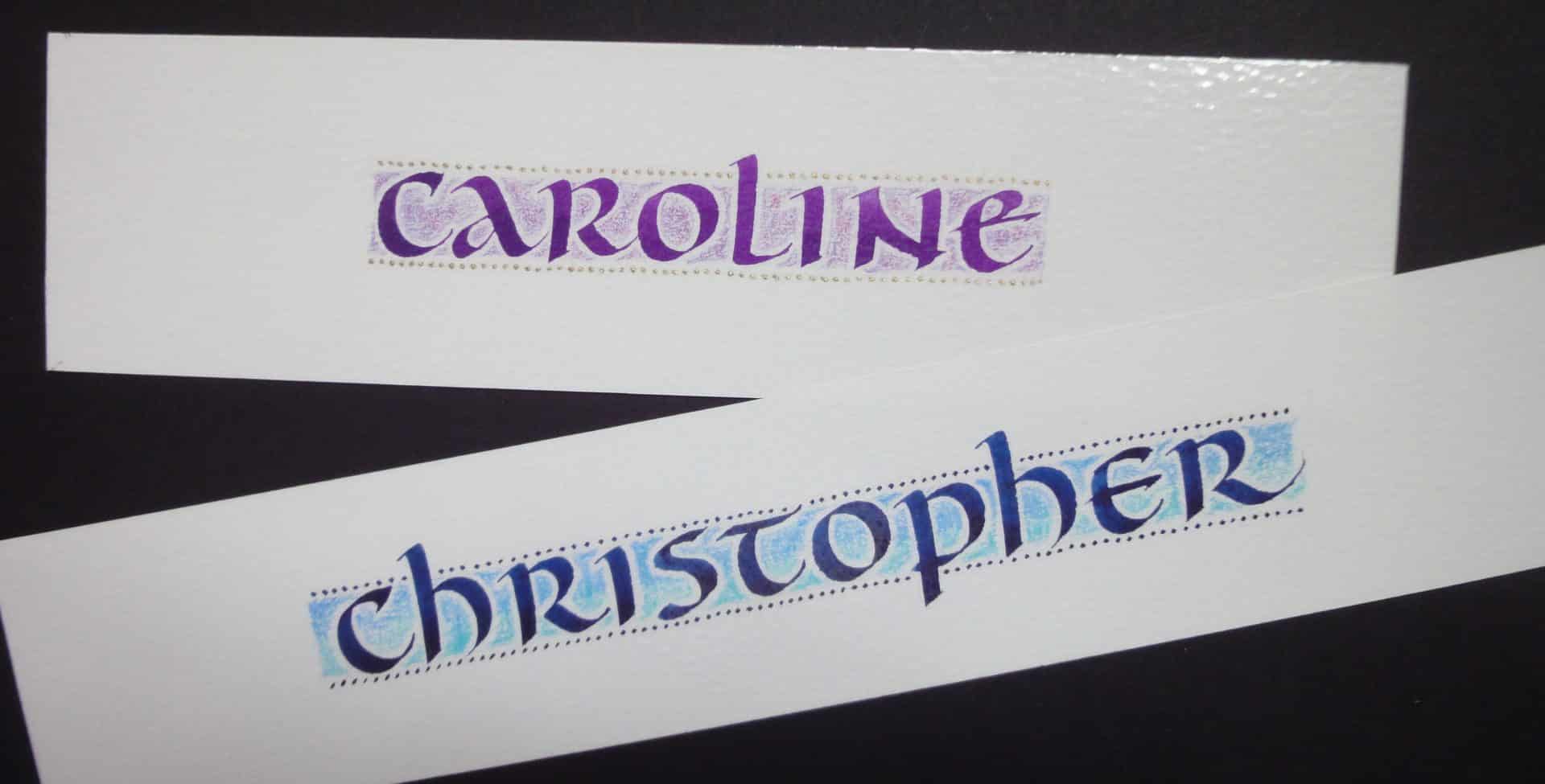 Image of two bookmarks with two names (Caroline and Christopher) in Calligraphic writing in Purple and Blue